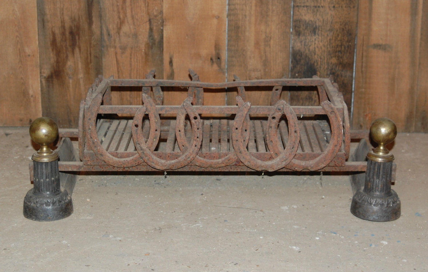 FB0017 A Rustic Fire Basket With Horseshoe Detail and Brass Fire Dogs