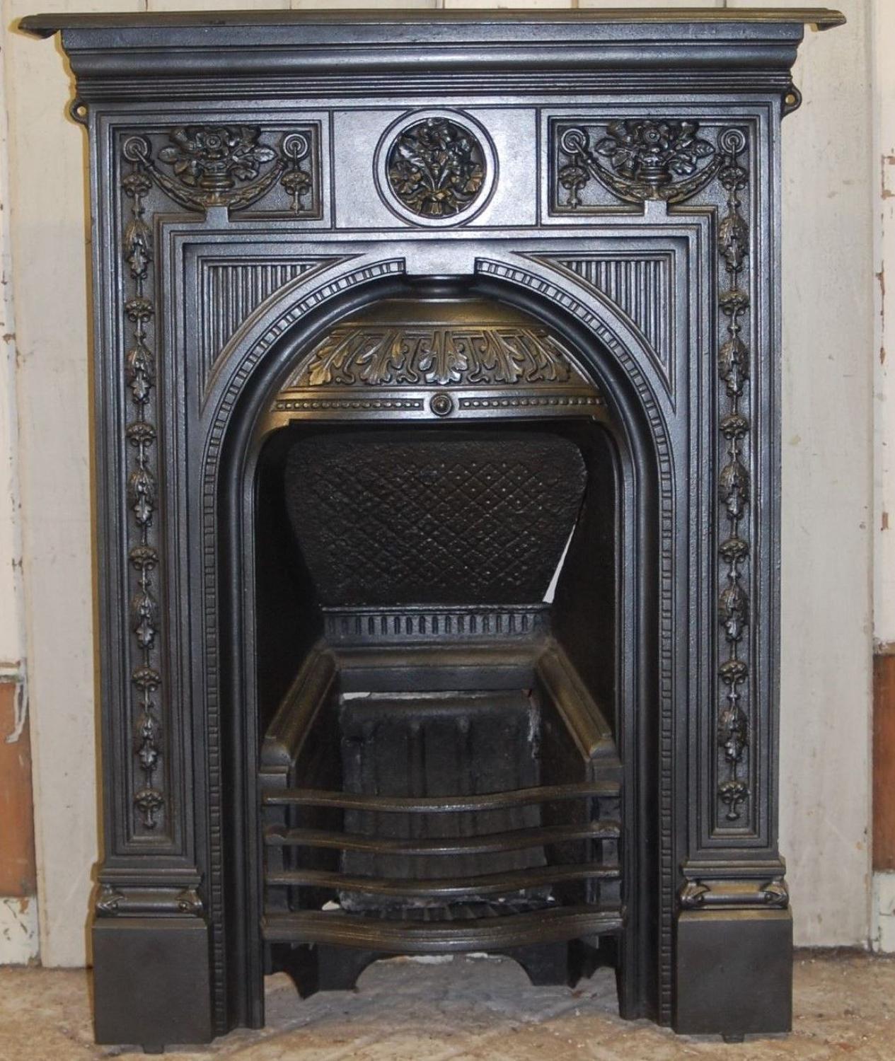An attractive decorative cast iron Victorian combination bedroom fire
