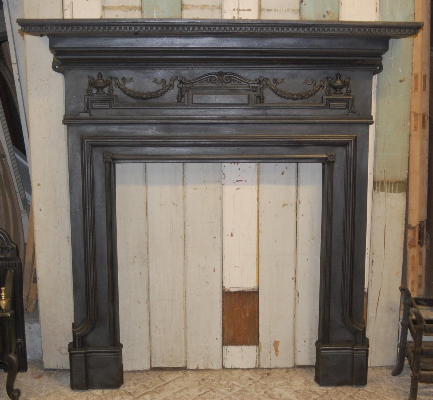 A large rare original Victorian cast iron fire / woodburner surround