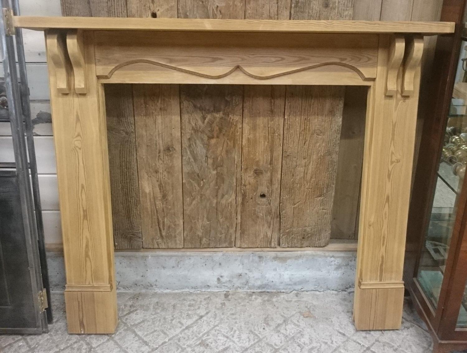 A reclaimed pine fire surround with Edwardian style design