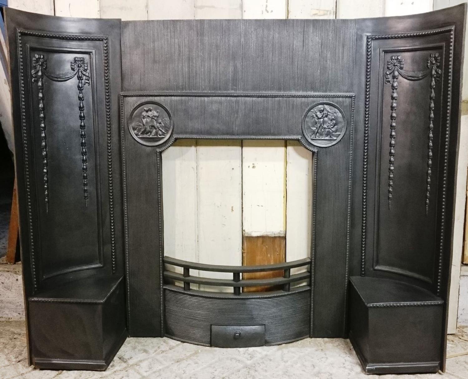 A Georgian or Neo-Georgian Cast Iron Fire Front and Decorative Cheeks