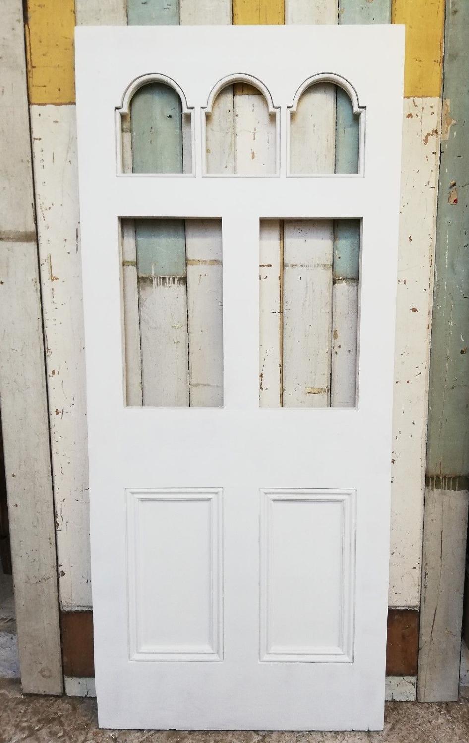 DE0774 A BEAUTIFUL VICTORIAN FRONT DOOR WITH ARCHED PANELS FOR GLAZING