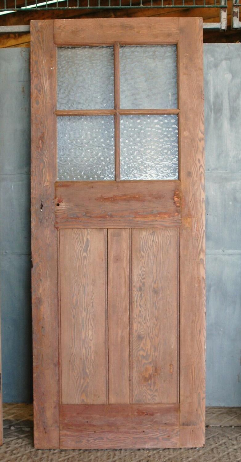 DB0654 AN ANTIQUE RECLAIMED PINE DOOR WITH GLAZING