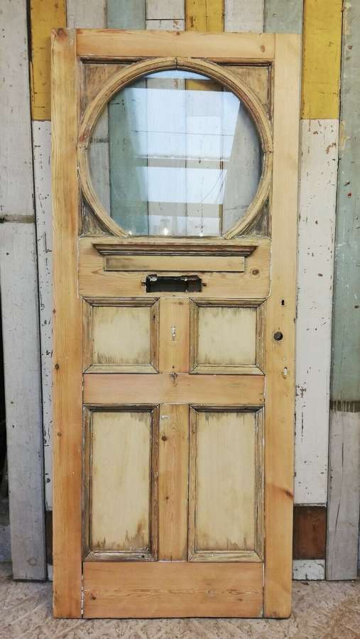 DE0820 A STRIPPED PINE EDWARIDAN FRONT DOOR WITH LARGE GLAZED PANEL