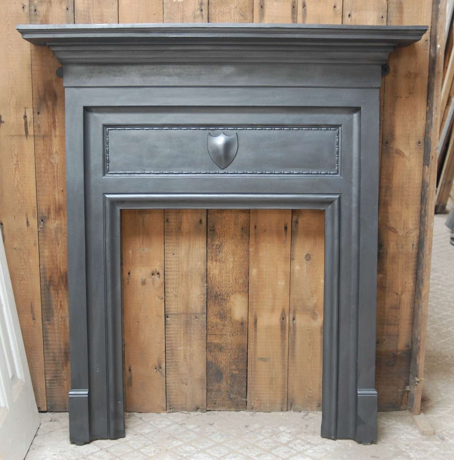 FS0115 A RECLAIMED EDWARDIAN CAST IRON FIRE SURROUND FOR WOODBURNER