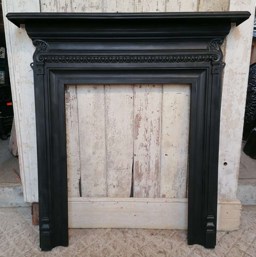 FS0130 A TALL ANTIQUE CAST IRON FIRE SURROUND FOR WOOD BURNER