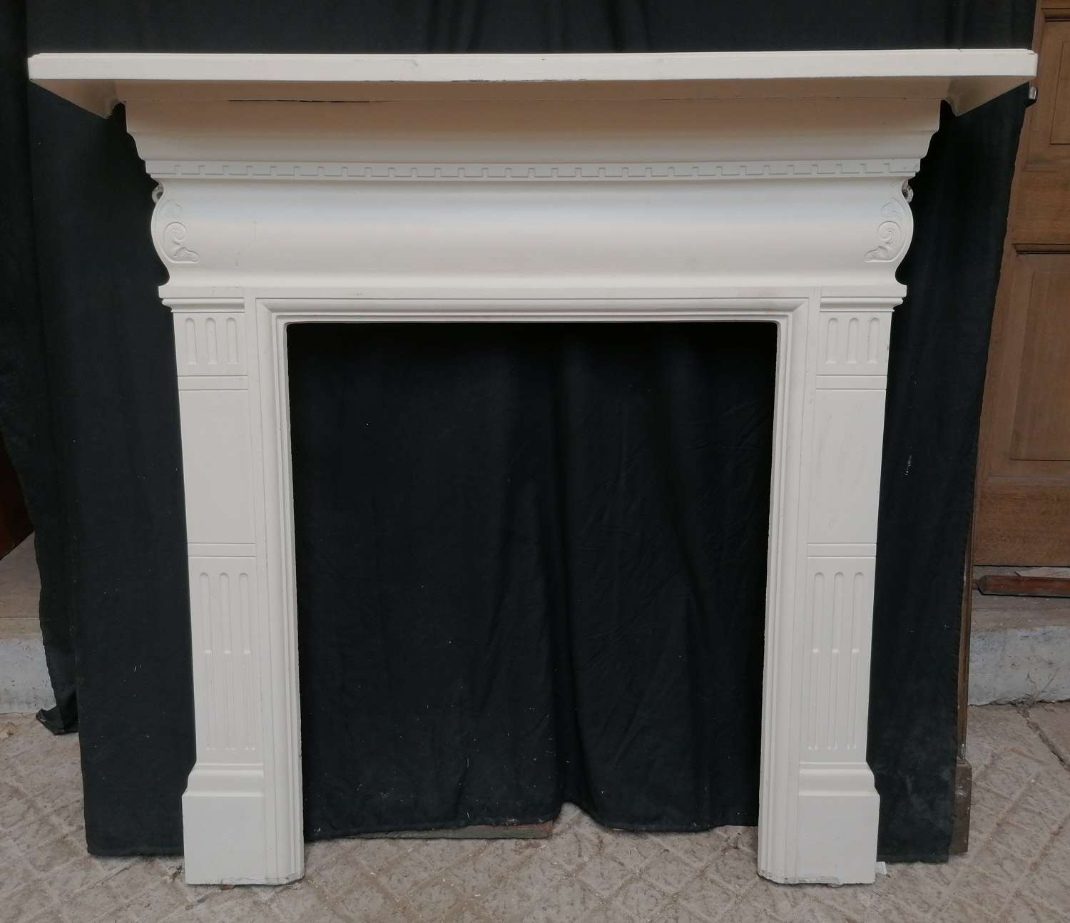 FS0154 A LARGE ANTIQUE RECLAIMED PAINTED CAST IRON FIRE SURROUND
