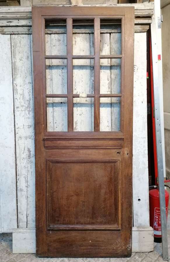 DE0921 A RECLAIMED EXTERNAL 1930's OAK DOOR WITH PANELS FOR GLAZING