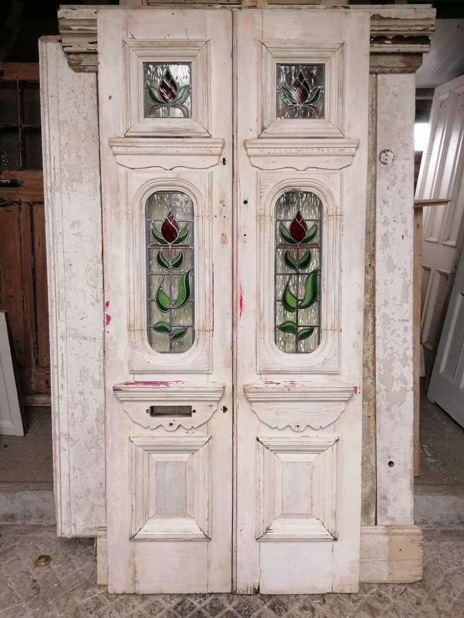 DP0365 A PAIR OF RECLAIMED PITCH PINE STAINED GLASS STORM DOORS