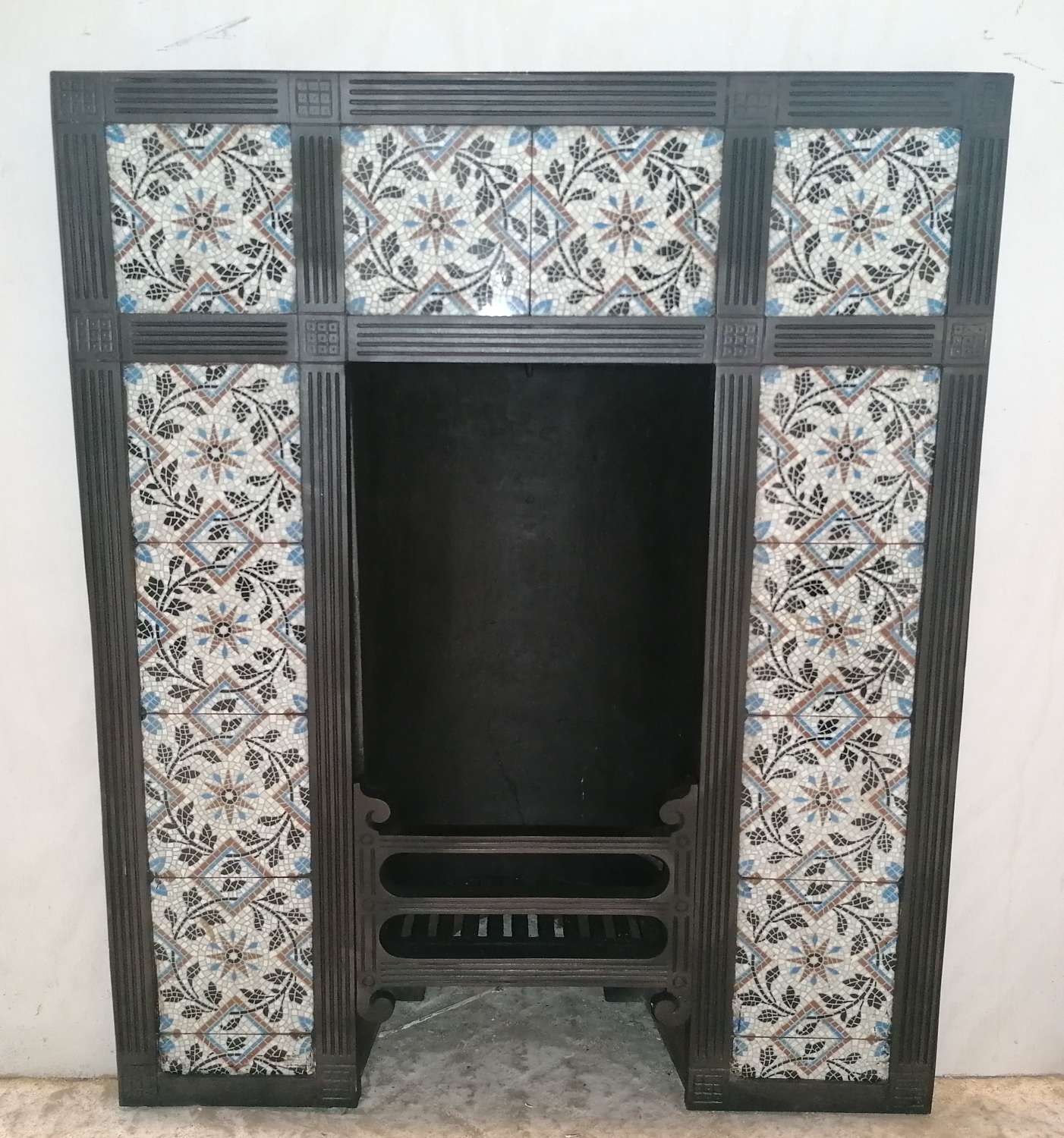 FI0063 A RARE AND VERY ATTRACTIVE MOSAIC TILED CAST IRON FIRE INSERT