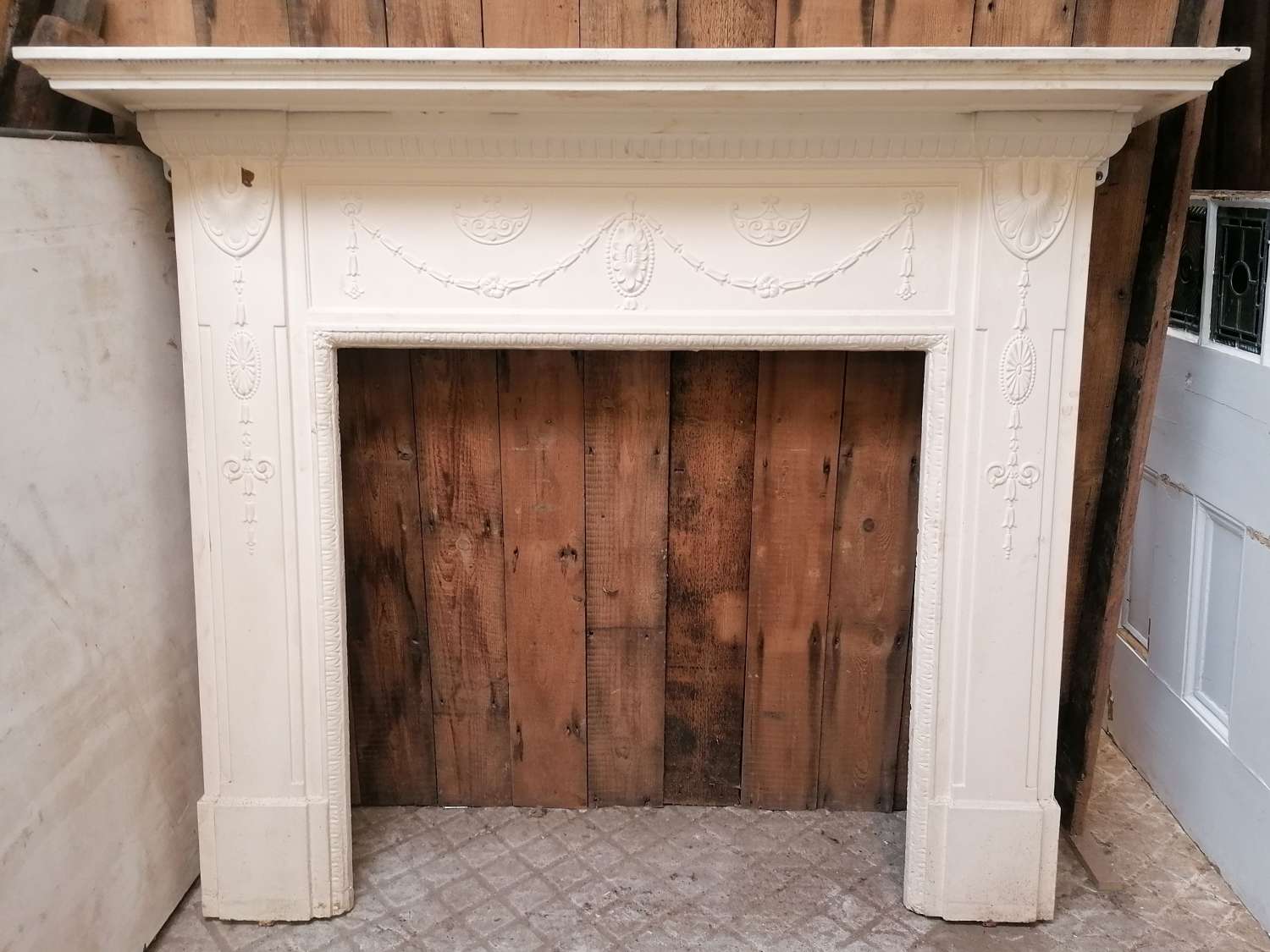 FS0203 A VERY LARGE ANTIQUE RECLAIMED PAINTED CAST IRON FIRE SURROUND