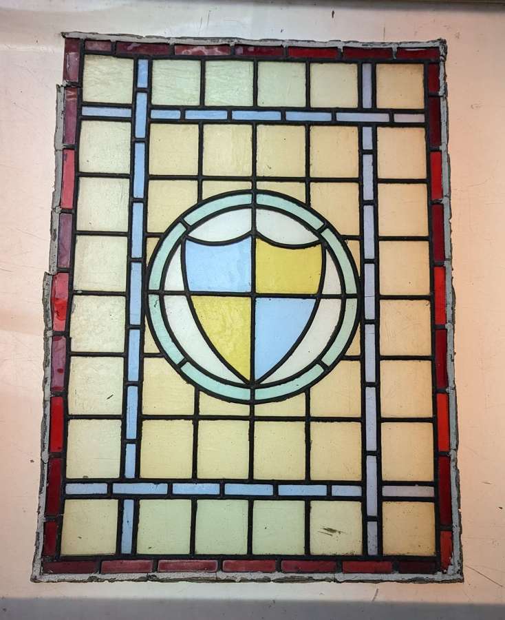 M1745 FIVE RECLAIMED STAINED GLASS PANELS WITH SHIELD DESIGNS