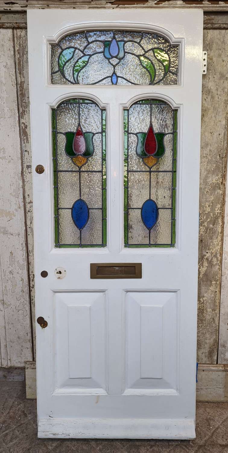 DE0976 A PRETTY RECLAIMED ANTIQUE PINE FRONT DOOR WITH STAINED GLASS