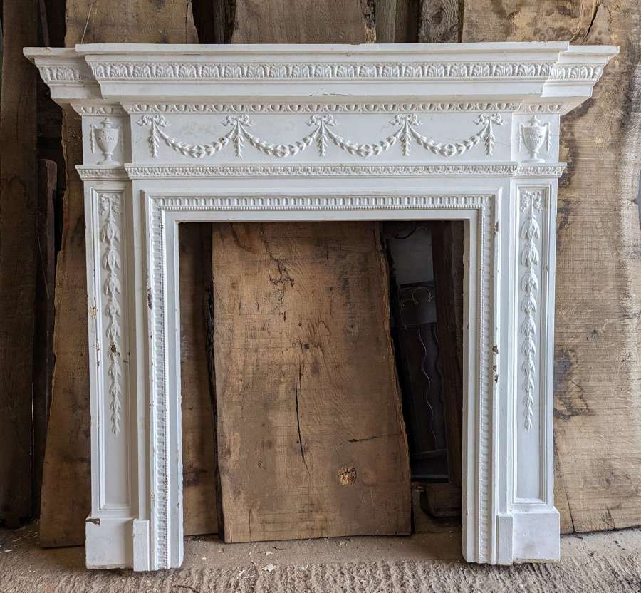 FS0279 A LARGE RECLAIMED VICTORIAN PAINTED CAST IRON FIRE SURROUND