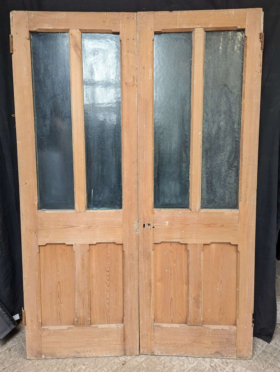 DP0490 A PAIR OF RECLAIMED STRIPPED PINE GLAZED DOORS