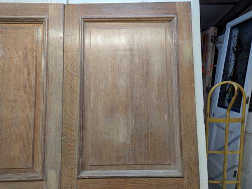DP0498 PAIR OF RECLAIMED SOLID OAK 1 OVER 2 PANEL DOORS C.1910
