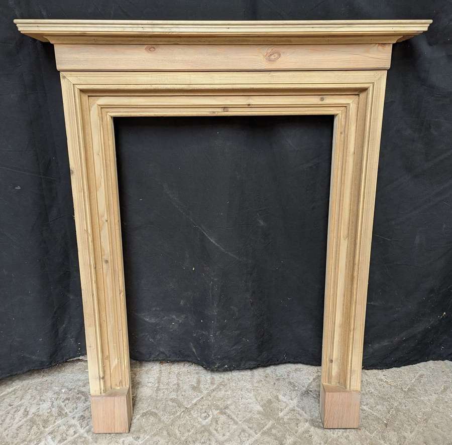 FS0309 A SMALL PINE FIRE SURROUND MADE USING RECLAIMED PINE ELEMENTS