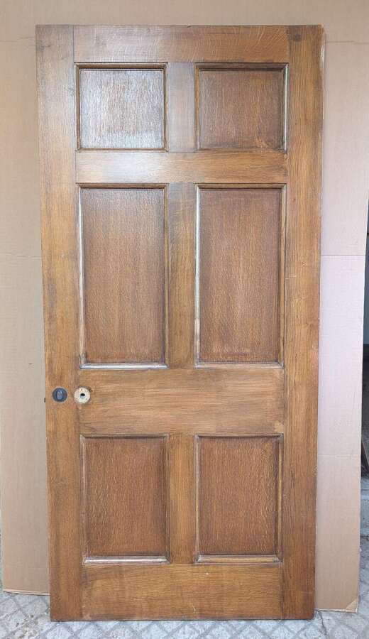 DI1006 A LARGE RECLAIMED OAK SIX PANEL DOOR FOR INTERNAL USE