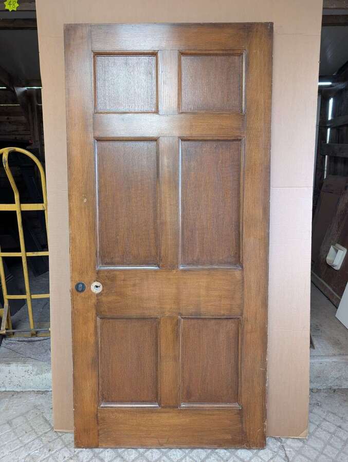 DI1007 A LARGE RECLAIMED OAK SIX PANEL DOOR FOR INTERNAL USE