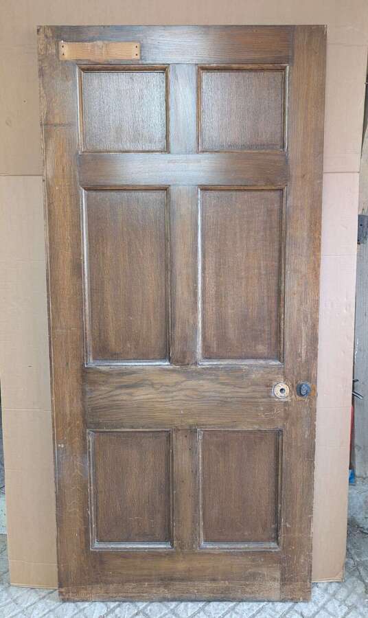 DI1021 A LARGE RECLAIMED OAK SIX PANEL DOOR FOR INTERNAL USE