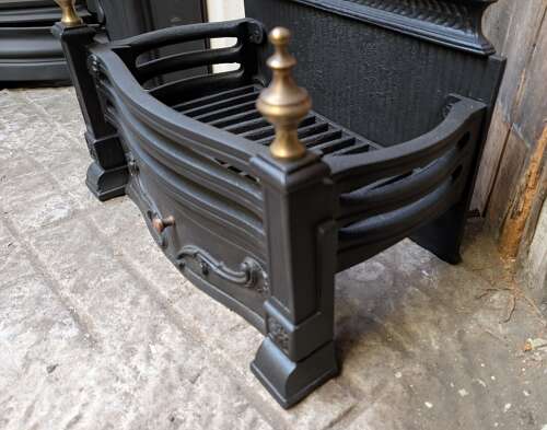 FB0196 A RECLAIMED ORNATE VINTAGE CAST IRON AND BRASS FIRE BASKET