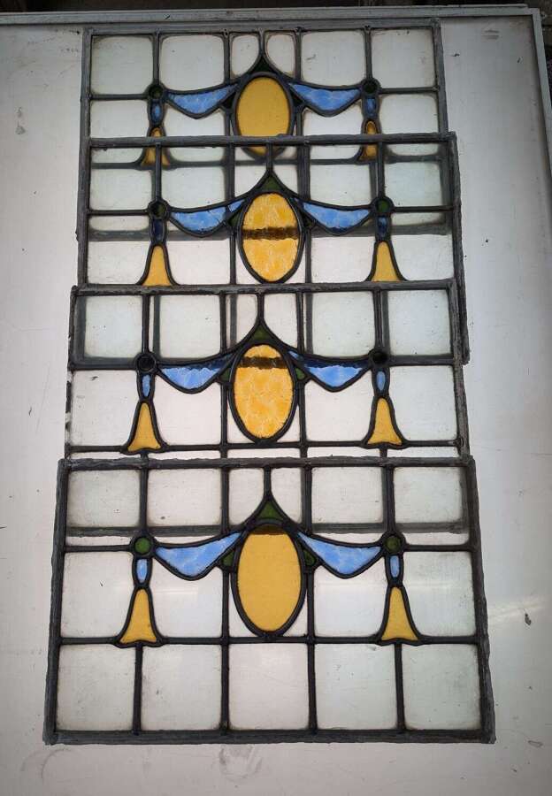 M2311 A SET OF FOUR RECLAIMED STAINED GLASS PANELS C.1920s