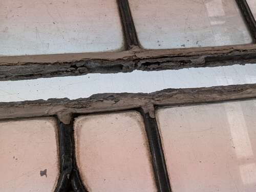 M2311 A SET OF FOUR RECLAIMED STAINED GLASS PANELS C.1920s