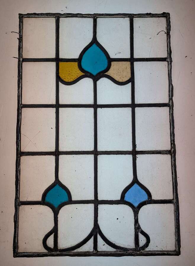M2312 A SET OF FOUR LARGE RECLAIMED STAINED GLASS PANELS C.1920s