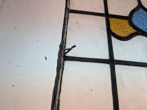 M2312 A SET OF FOUR LARGE RECLAIMED STAINED GLASS PANELS C.1920s
