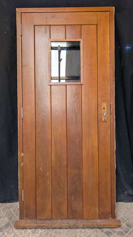 DE1052 A RECLAIMED MODERN OAK EXTERNAL / FRONT DOOR AND FRAME WITH GLAZED PANEL