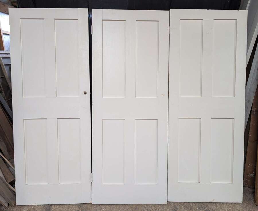 CS0174 A SET OF THREE RECLAIMED "COTTAGE STYLE" PAINTED PINE CUPBOARD DOORS