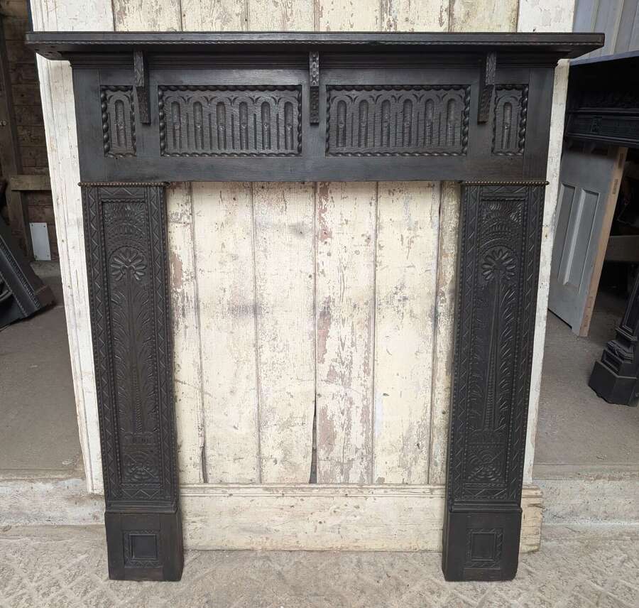 FS0477 A HAND CARVED OAK FIRE SURROUND EARLY VICTORIAN WITH SOME TUDOR PANELS