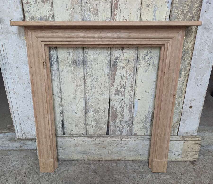 FS0486 AN ELEGANT OAK FIRE SURROUND MADE FROM NEW OAK