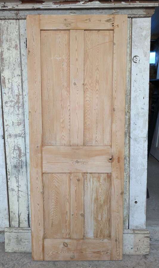 DI1124 A RECLAIMED STRIPPED PINE FOUR PANEL INTERNAL DOOR