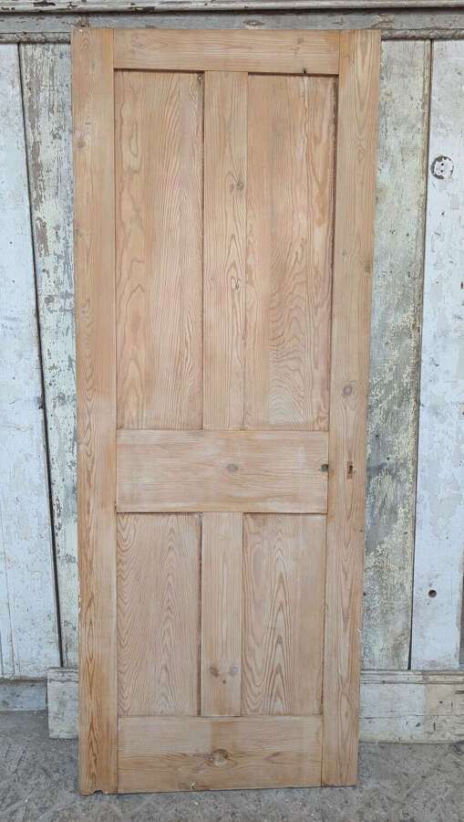 DI1126 A RECLAIMED STRIPPED PINE FOUR PANEL INTERNAL DOOR